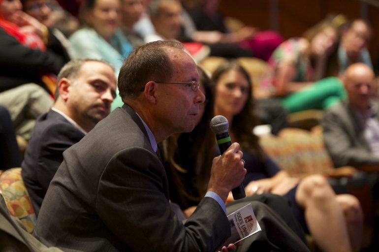 A representative from the State Department responds to a question from the Syrian women