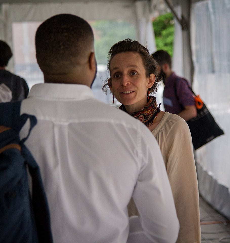 Two people talking at an event